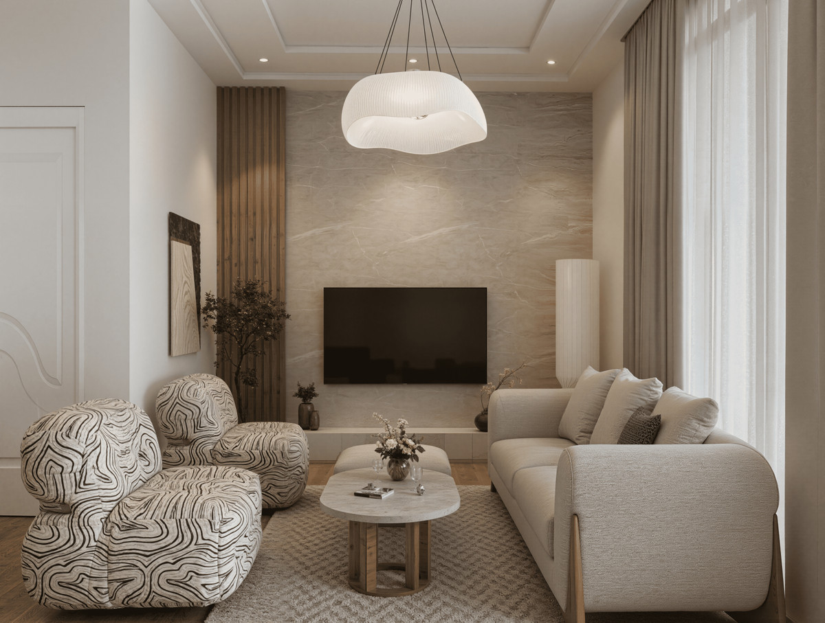 Villa Colombia – Casares – luxuriöses Wohnzimmer mit Marmor-Akzentwand, auffälliger Pendelleuchte und geschwungenem Sessel