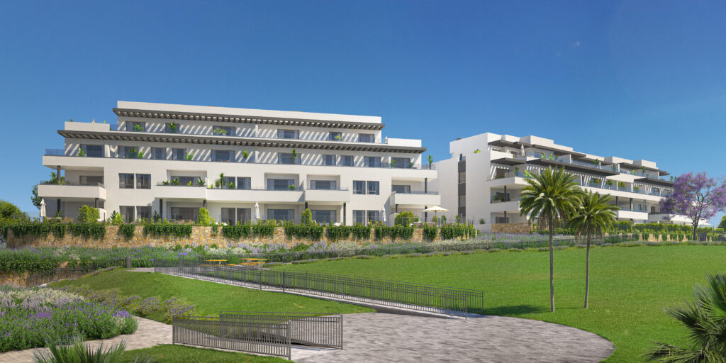 Vitta Marina – La Cala de Mijas - modern white residential complex with landscaped gardens and palm trees under blue sky
