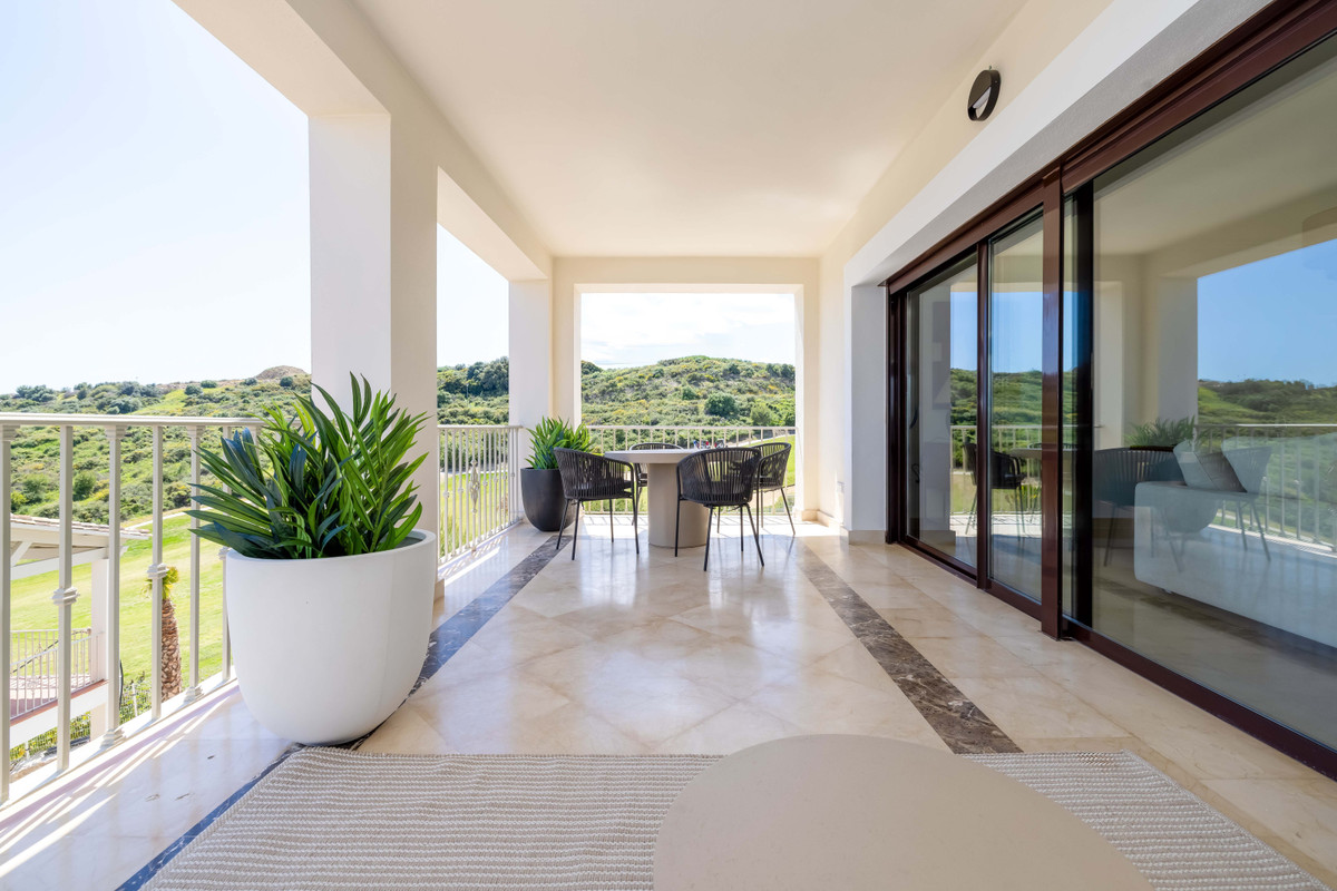 Altoasis – Valle Romano - spacious covered terrace with marble flooring, outdoor dining set and panoramic golf course and hillside views