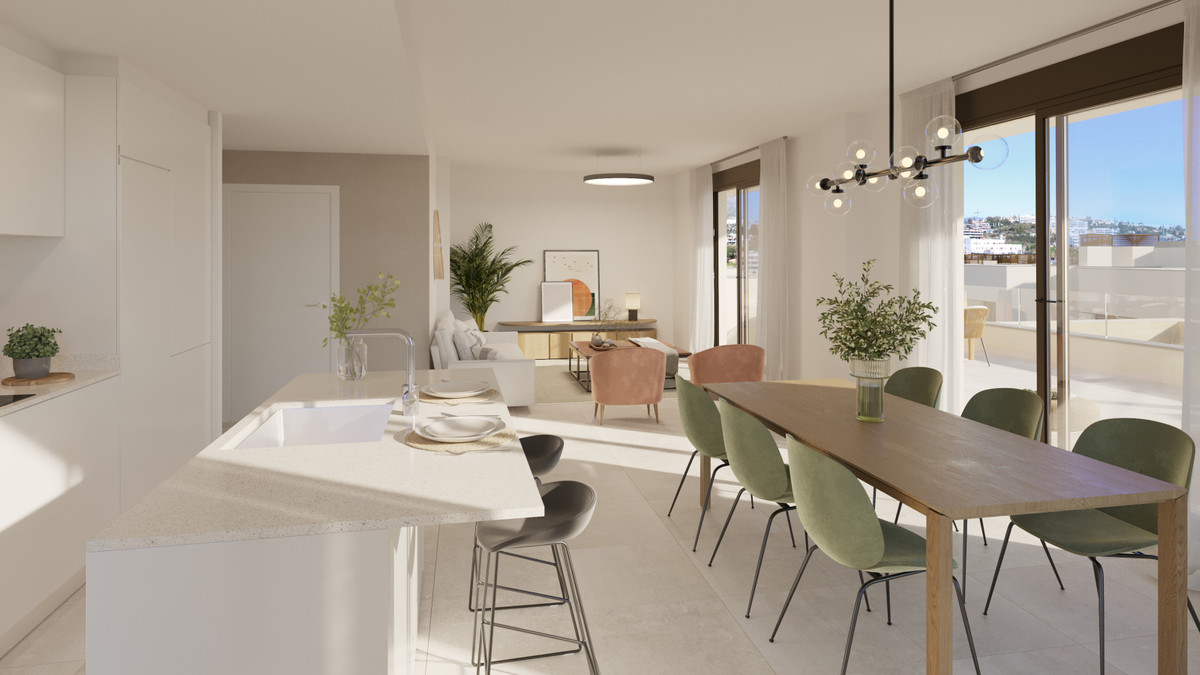 Bayside Homes – Estepona - åbent køkken-alrum med grønne stole og lys stue med adgang til terrasse