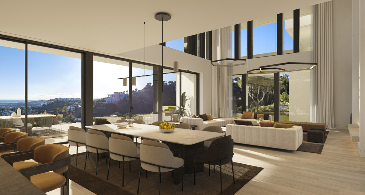 El Bosque II – Villa Stonehaven – Benahavís - open eet- en woonkamer met vloer-tot-plafond beglazing en panoramisch uitzicht op de heuvels