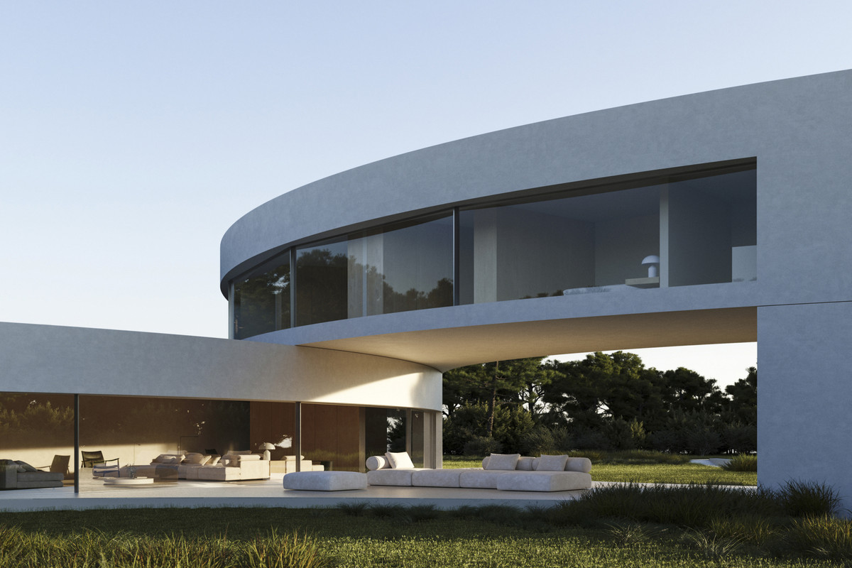 Villa STERN – San Roque - curved concrete exterior facade with panoramic glazing, open terrace, and outdoor seating on lush lawn