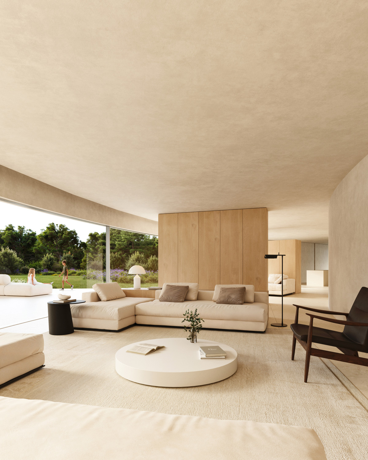 Villa STERN – San Roque - minimalist open-plan living room with cream sectional sofa, round white coffee table, and floor-to-ceiling garden views