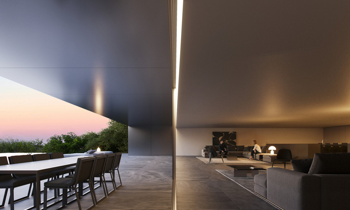 Villa OAK – San Roque - indoor-outdoor living area at dusk with terrace dining and warm-lit lounge seating