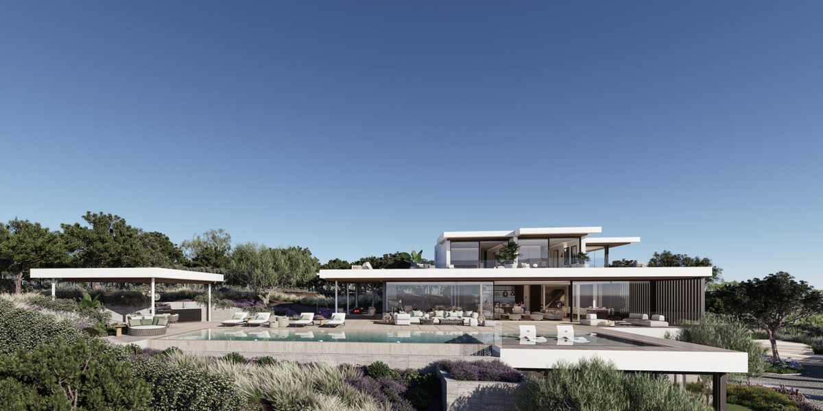 VILLA RETIRO – The Collection – Sotogrande - modern luxury villa exterior with infinity pool, terrace seating and landscaped gardens