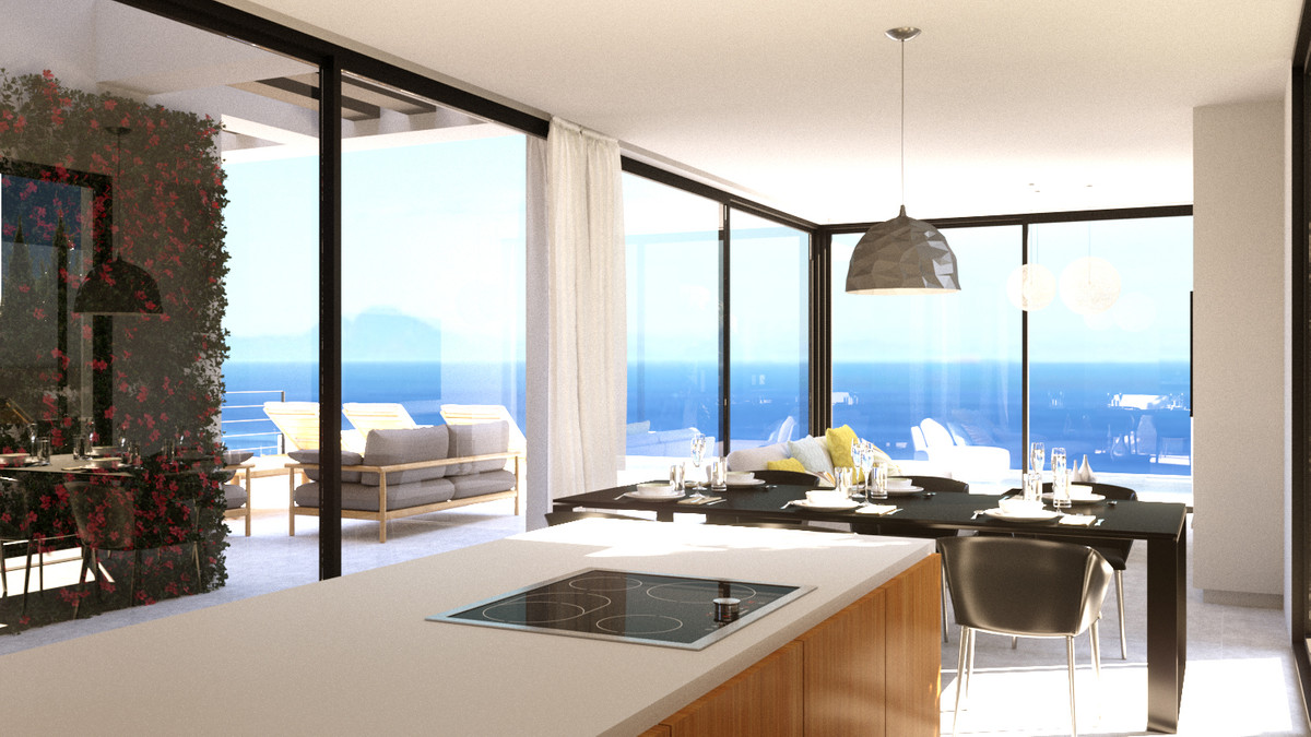 Stupa – Villa Shanti – Mijas Golf - open keuken en eethoek met panoramisch zeezicht door vloer-tot-plafond beglazing