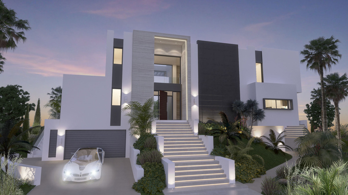 Villa Armonía – La Cala Golf - luxe villa-gevel in de schemering met verlichte trap en witte BMW cabrio in garage