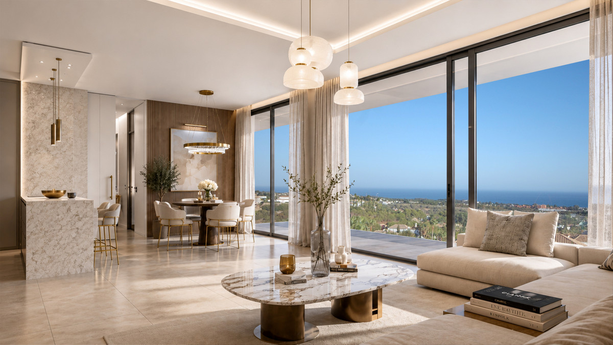 VILLA EVANIA Los Flamingos – Benahavís - åbent stue- og spisemiljø med marmorbord og panoramaudsigt over havet