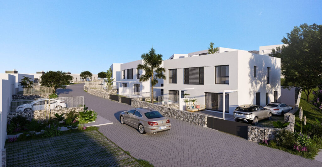 Alya Mijas FASE I, II – Mijas - modern white townhouses with cobblestone street, parked cars and palm trees on the Costa del Sol