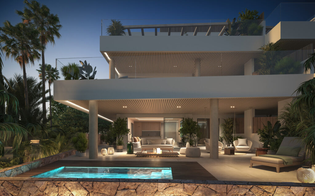 Aruna – Marbella - luxury outdoor terrace with illuminated pool, open-plan living area and multi-level facade at dusk
