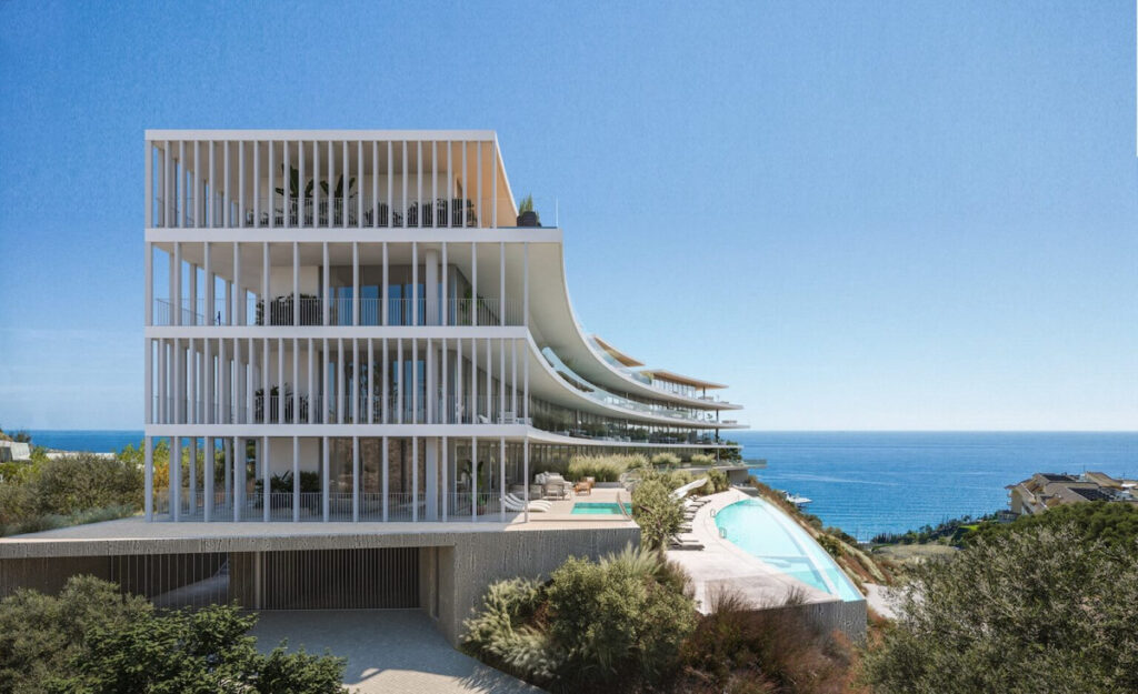 Lighthouse Higuerón Residences – Fuengirola - modern white facade with vertical fins, cascading terraces, and infinity pool overlooking the Mediterranean Sea
