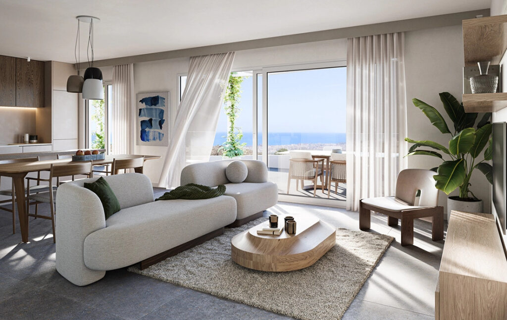 Mijas Seaviews FASE II – Mijas - bright open-plan living room with grey sofa, wooden coffee table, and panoramic sea views through floor-to-ceiling sliding doors