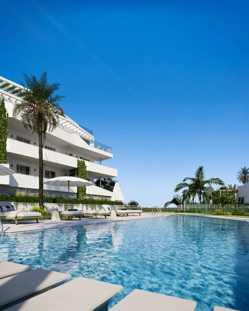 Mijas Seaviews FASE III – Mijas - outdoor swimming pool with sun loungers and white residential building surrounded by palm trees