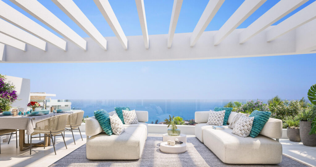 Royal Palms Mijas – FASE IV-2 – La Cala de Mijas - luxury terrace with white pergola, outdoor sofas and panoramic sea views