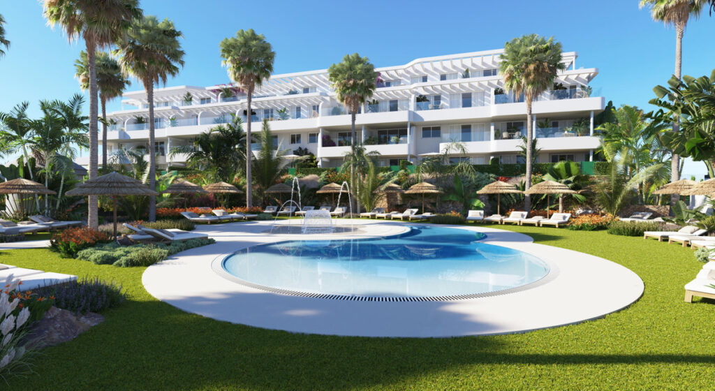 Royal Palms Mijas – FASE IV-4 – La Cala de Mijas - luxury outdoor pool and tropical garden with white residential building