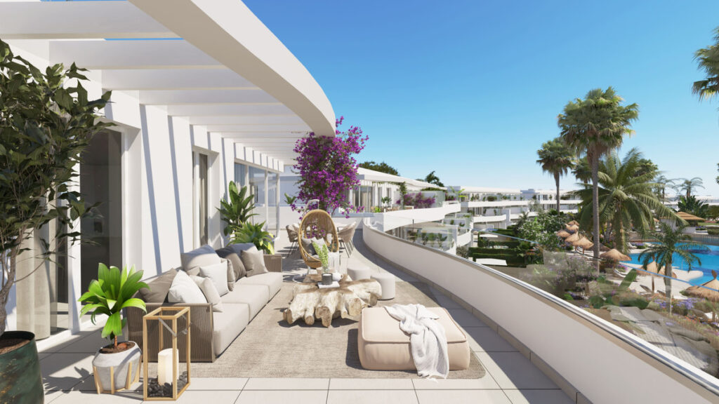 Serenity Frontline Golf Homes and Beach Club – PHASE IV – La Alcaidesa - curved terrace with outdoor lounge seating, pool and palm tree views