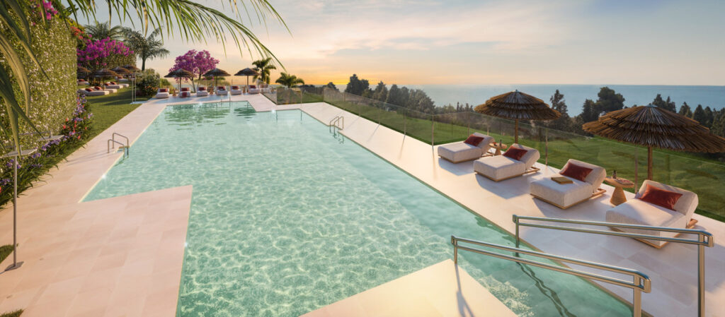 Soleia Living FASE II – El Chaparral - infinity pool with sun loungers and panoramic sea views at sunset