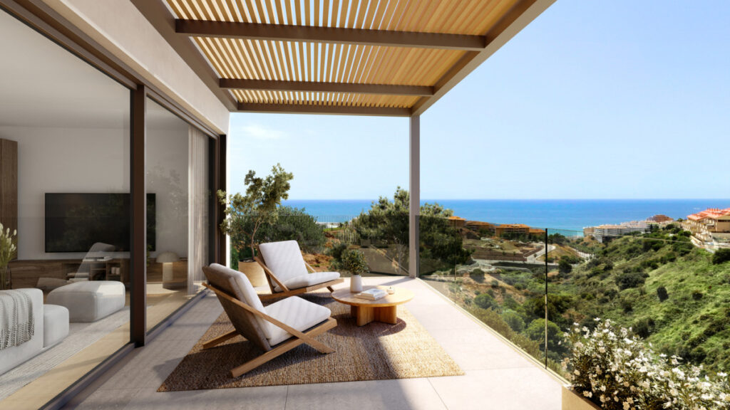 Veridian II – Fuengirola - luxury terrace with lounge chairs, pergola, and panoramic sea views over lush hillside