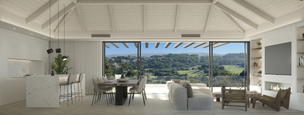 Villa ALHAMA de La Reserva – San Roque - open-plan living and dining area with vaulted white timber ceiling and panoramic golf and landscape views