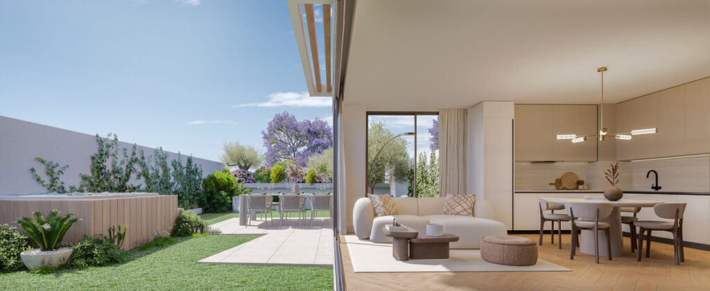 Ykines – Torremolinos - open-plan living room and kitchen flowing onto a landscaped private garden with jacaranda trees