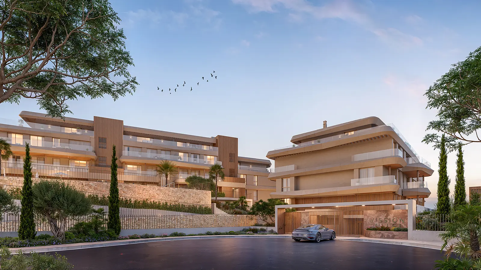 Vission Hills – two modern buildings with terraces and stone walls at dusk