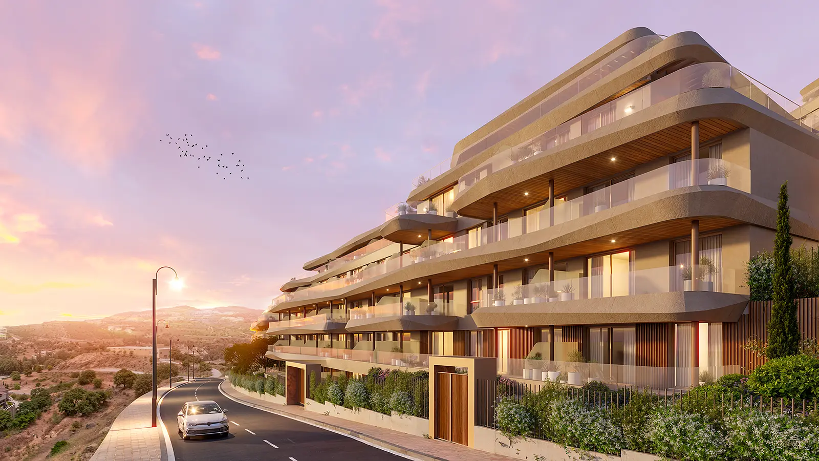 Vission Hills multi-storey façade with wide balconies glowing in warm sunset light