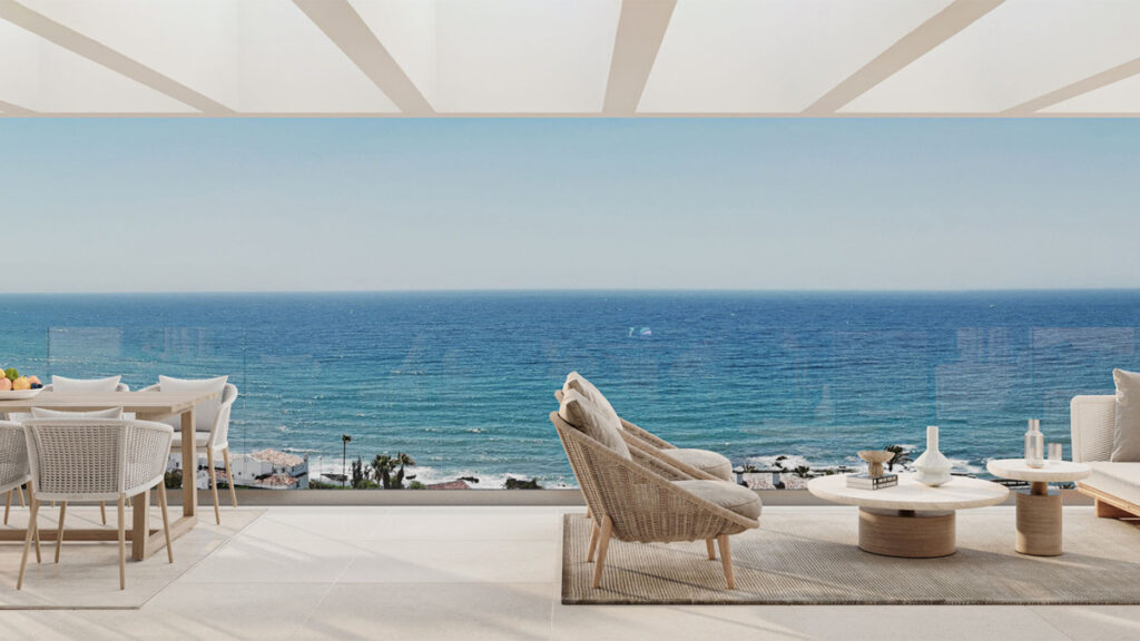 Arosa – Mijas - luxury terrace with wicker chairs, dining area and panoramic Mediterranean sea views from Costa del Sol new development
