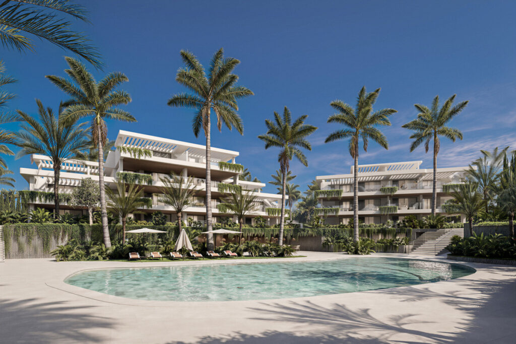 Almina Residences – Estepona - luxury white apartment complex with tropical palm trees and lagoon-style pool