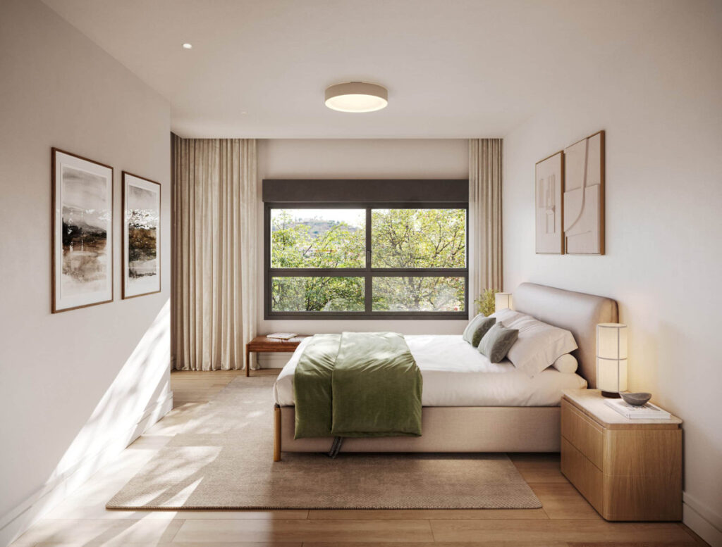 Miramar 34 – Málaga Este - serene bedroom with green throw, timber floors, and lush tree views through large window