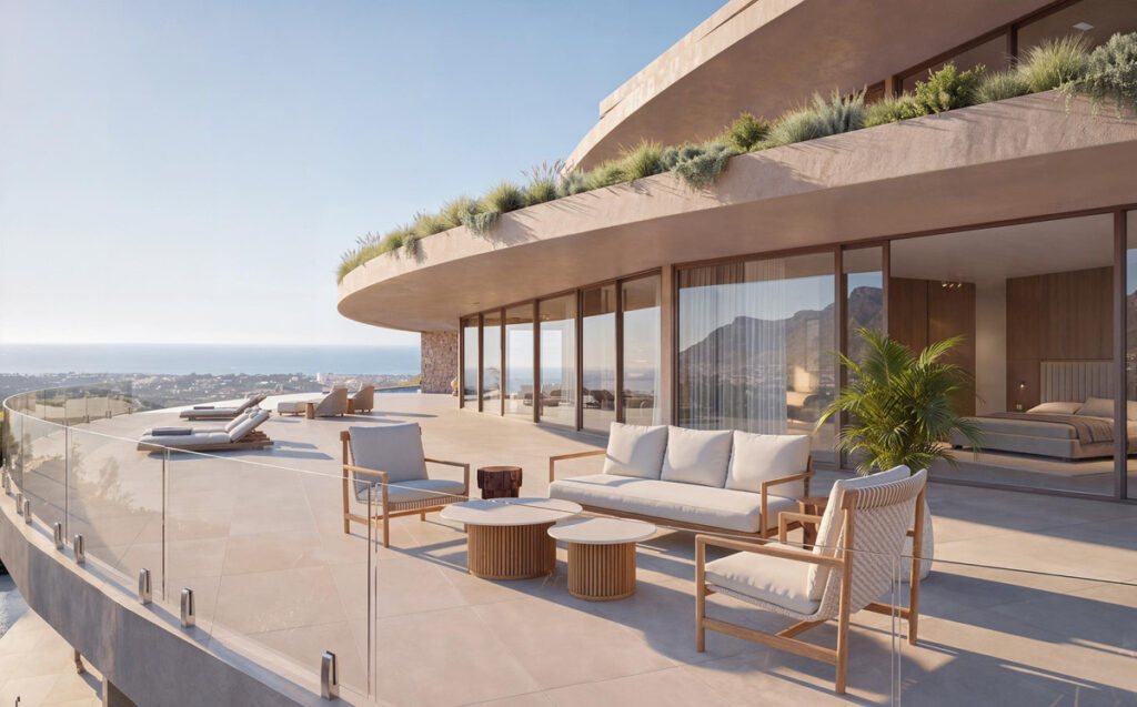 Vitae Villas C8 – Benahavís - curved terrace with outdoor lounge seating, glass balustrade, and panoramic sea and mountain views